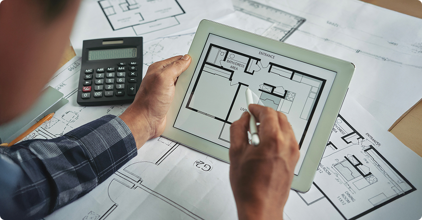 A cost estimator at LantroTech presenting planning strategies using charts and digital plans, emphasizing the role of proactive budgeting and forecasting in successful low-voltage project execution.
