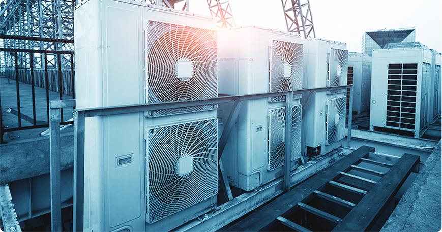 HVAC components like ducts and chillers in a large building, showing LantroTech's reliable, cost-effective indoor air solutions.
