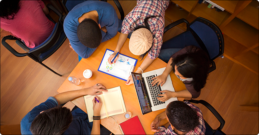 Designer sketching alongside AI-generated visuals — LantroTech’s blend of human creativity and smart tech.