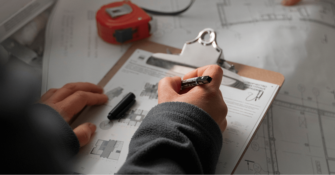 Team of professionals reviewing construction plans and shop drawings, highlighting LantroTech’s focus on collaboration, clarity, and standardized project execution.