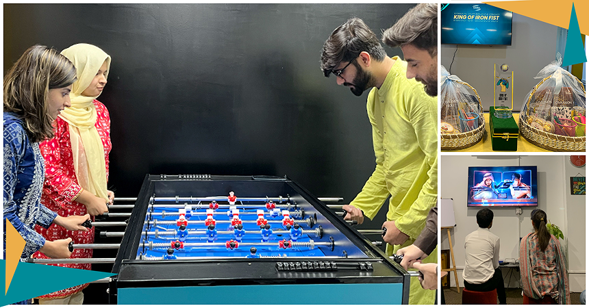 LantroTech employees playing foosball and enjoying the office game room, highlighting how intentional breaks and play are integrated into the daily culture for a better work-life balance.