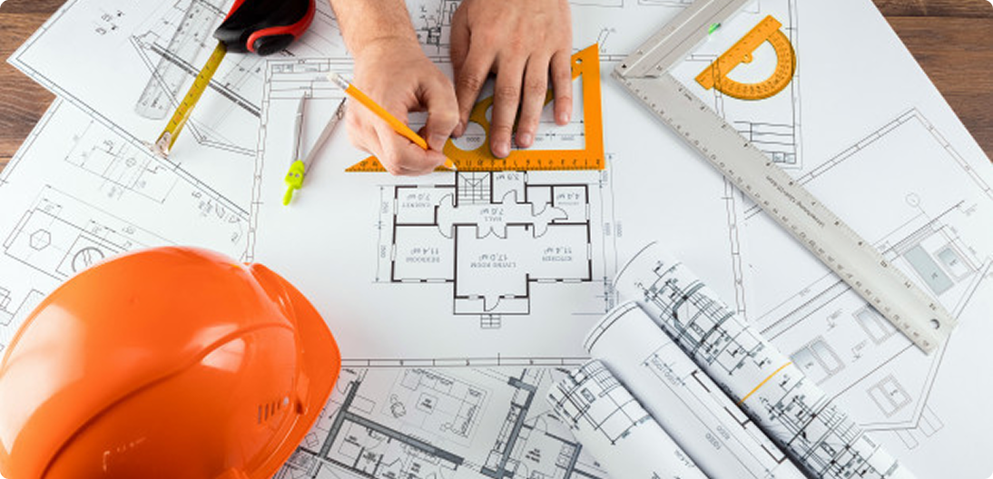 A LantroTech professional reviewing detailed shop drawings and blueprints to ensure the project meets strict design intent.